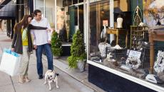 Two people window shopping along Main Street in Farmville, Virginia.