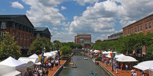Festival tents along each side of the creek in downtown Frederick