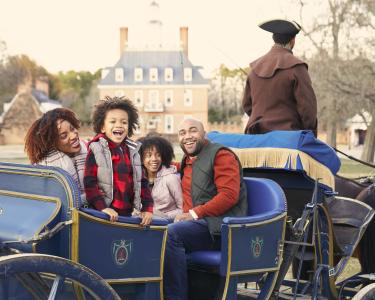 A family riding in a carriage