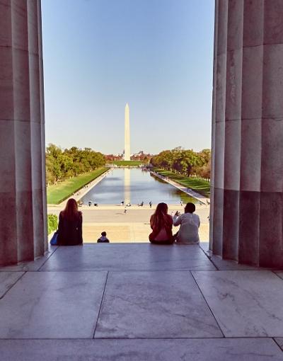 A photograph from the inside of the Lincoln Memorial looking out at the Washington Monument in Washington, DC, USA.